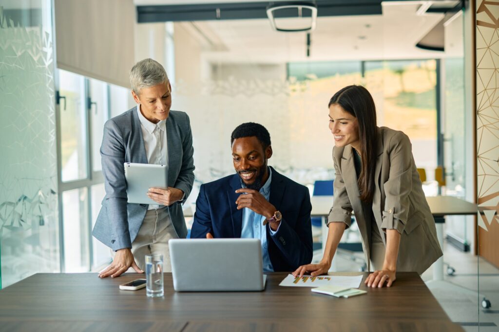 Business team discussing at a laptop