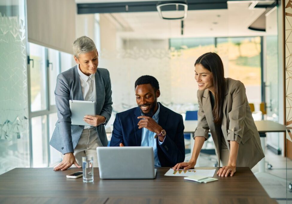 Business team discussing at a laptop